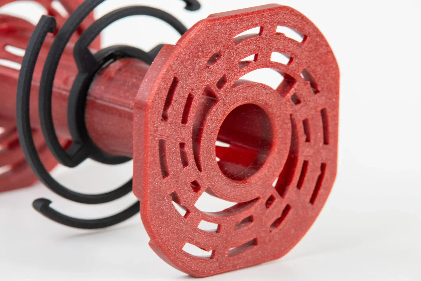 Close-up of Vintage Visual 4x5 reel designed for Paterson tanks, showcasing its high-quality red PETG plastic construction.