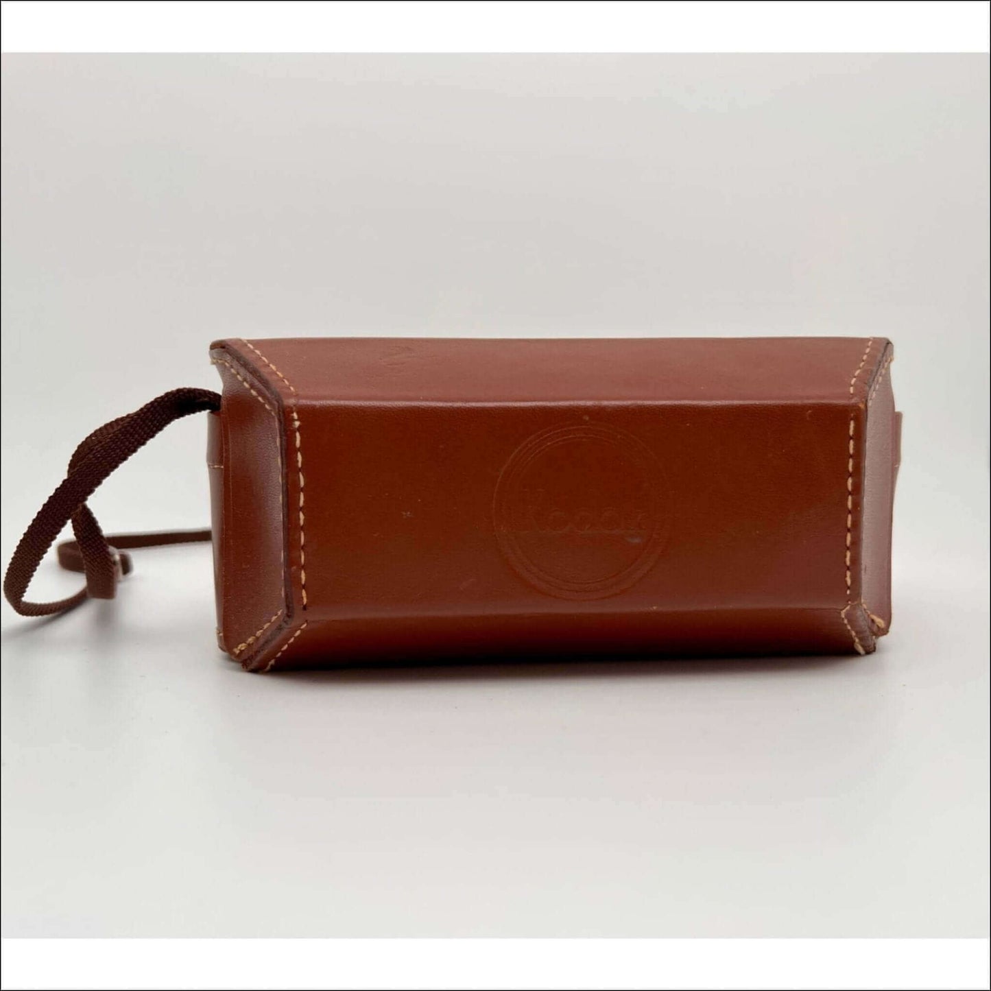 Kodak vintage leather case for 35mm stereo film camera, showing minor stitching wear, sold as is.