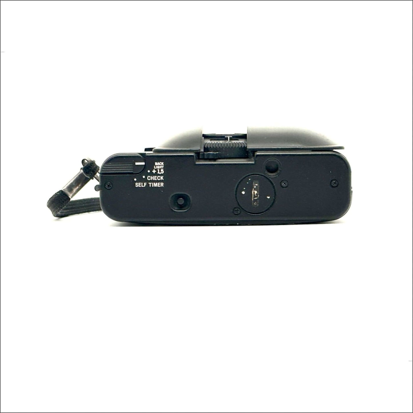 Side view of Olympus XA used 35mm vintage film camera showcasing controls and self-timer features.