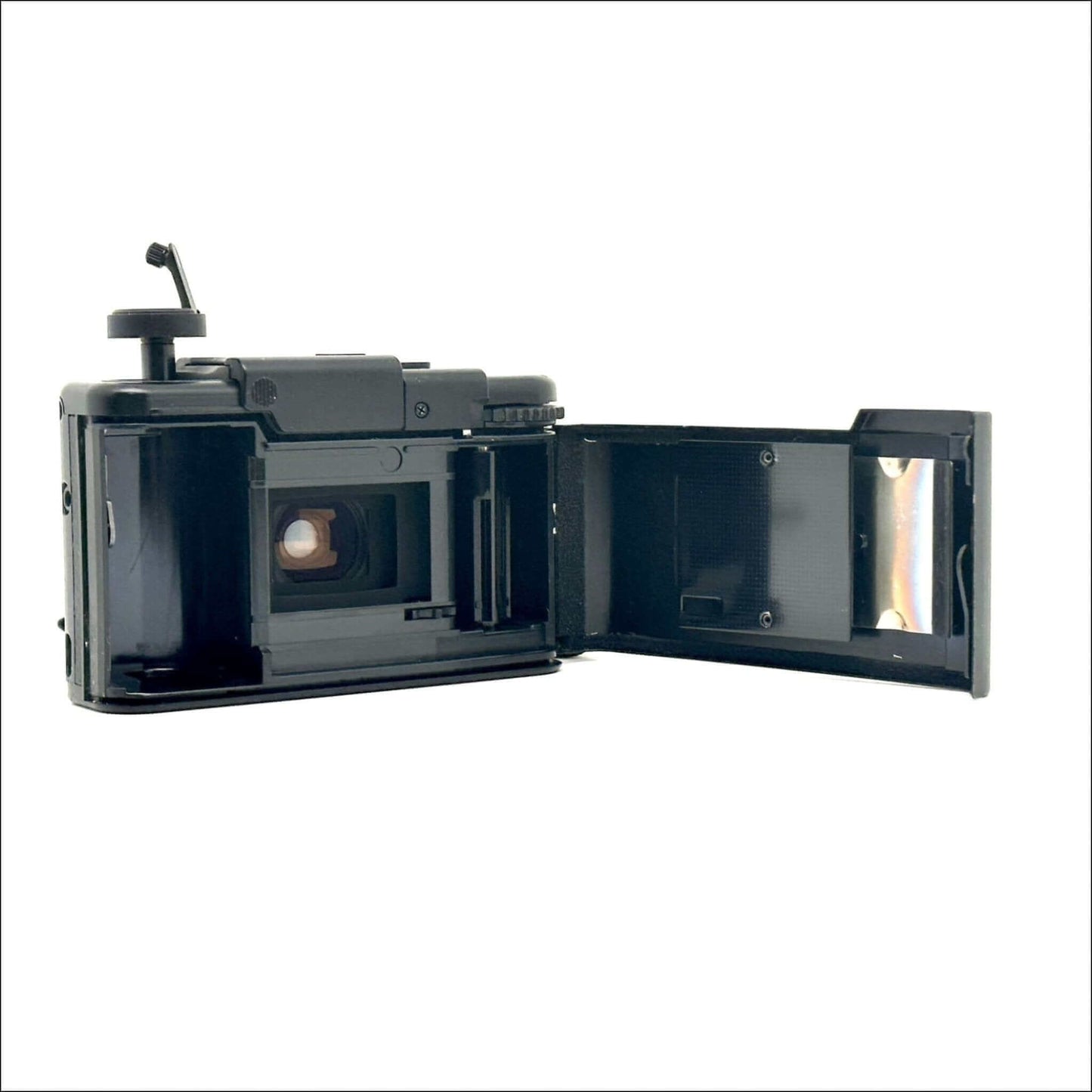 Olympus XA used 35mm vintage film camera showing open chamber and lens area, in fine working condition.