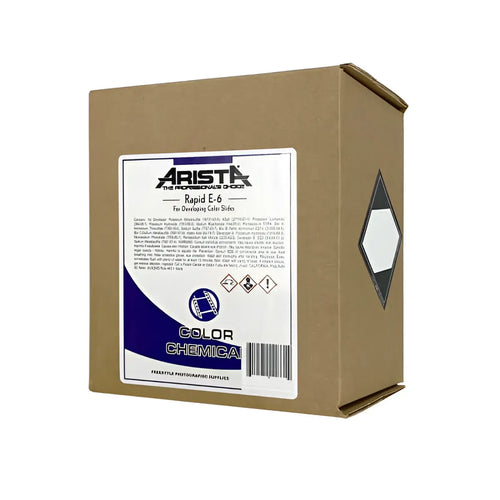Arista rapid e-6 color chemical for developing film, packaged in a brown cardboard box with a white and blue label.