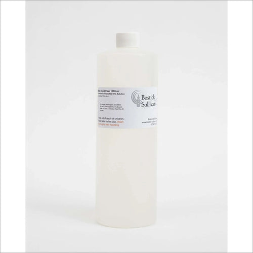 A translucent white plastic bottle with a white cap, labeled ’bostick sullivan’ and marked as containing 1000 ml of bsi rapid fixer solution.