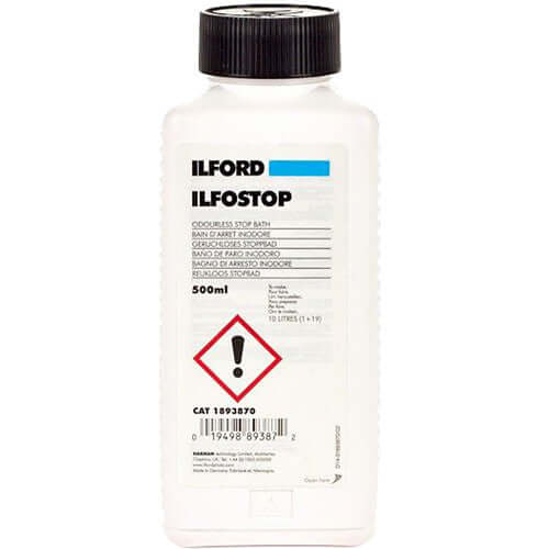 Ilford Ilfostop BW Citric Acid Stop Bath Liquid (500 ml) bottle with clear label and warning symbol.