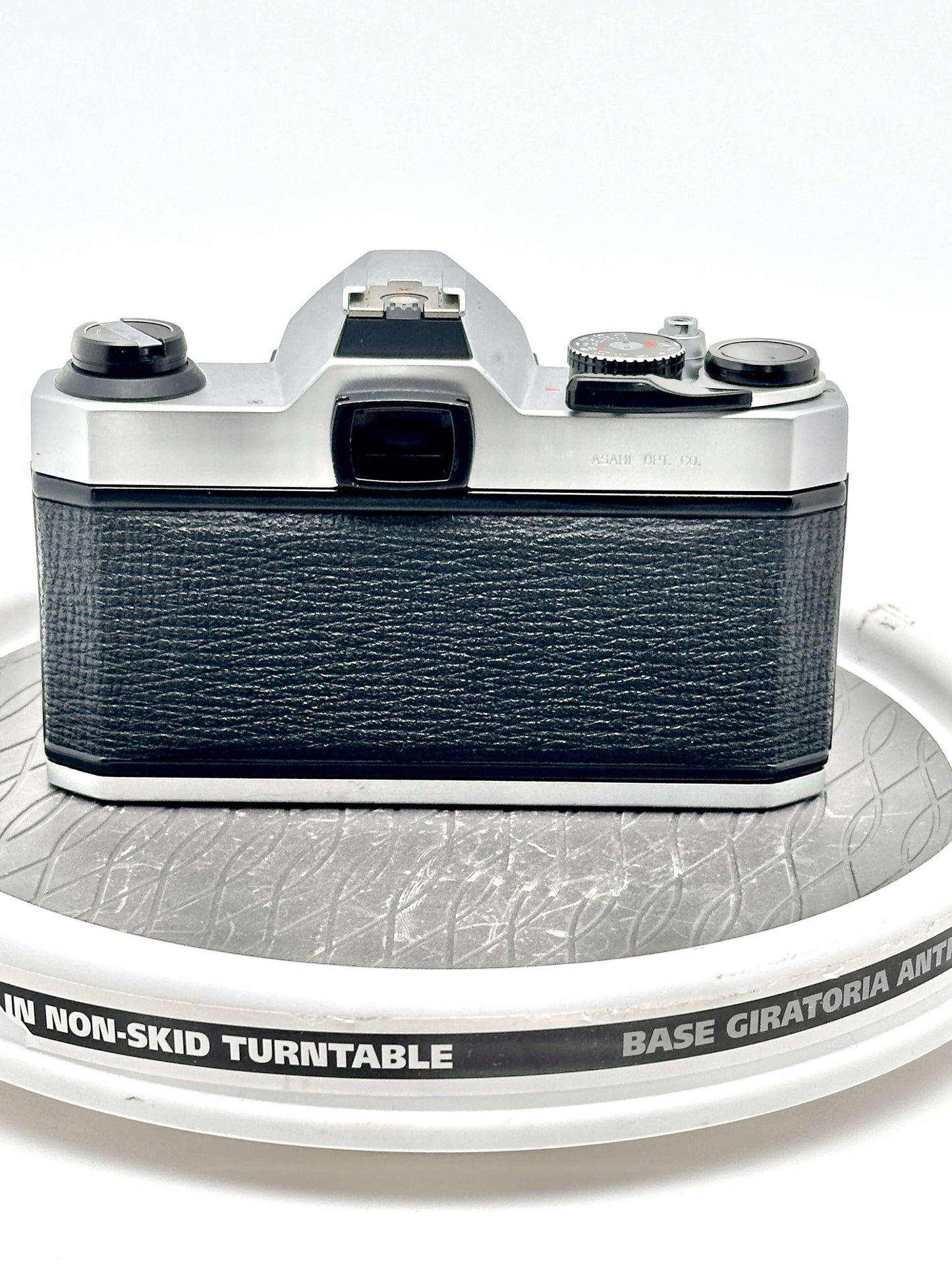 Pentax K1000 used 35mm film camera viewed from the back, showcasing its classic design and robust construction.