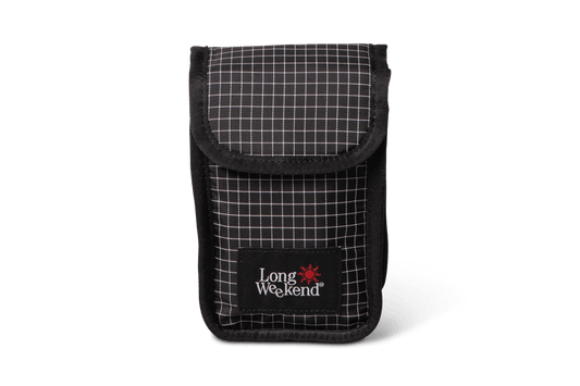 Long Weekend Camera Pouch in black with grid pattern for protecting point-and-shoot cameras.