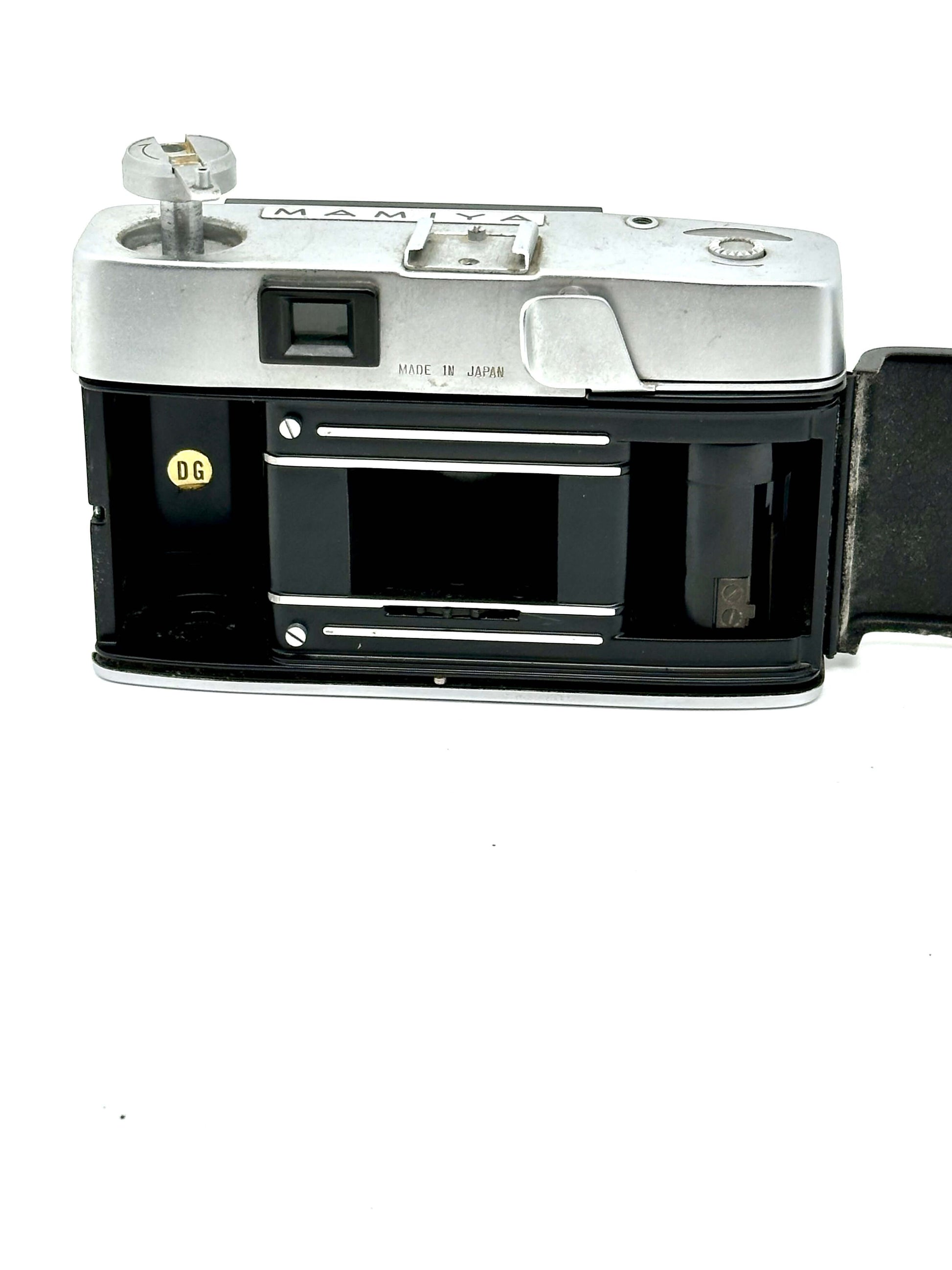 Mamiya Kominar vintage rangefinder 35mm film camera, showing rear view and film compartment.