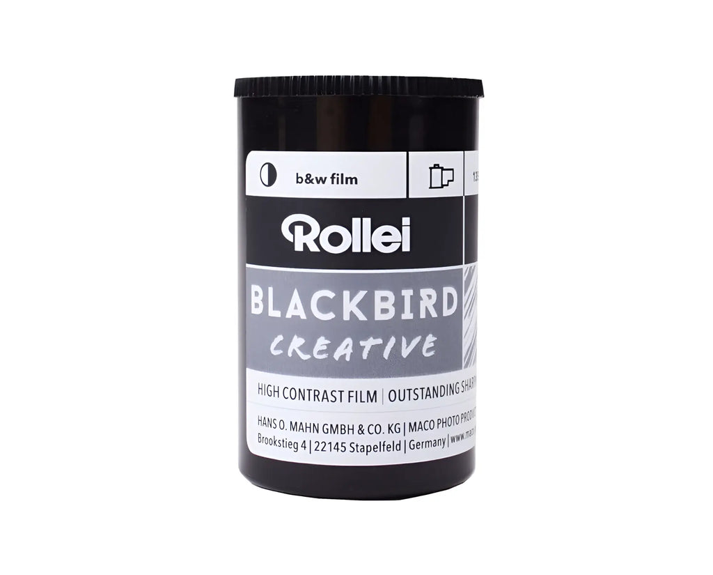 Black cylindrical canister of rollei blackbird creative high contrast black and white film.