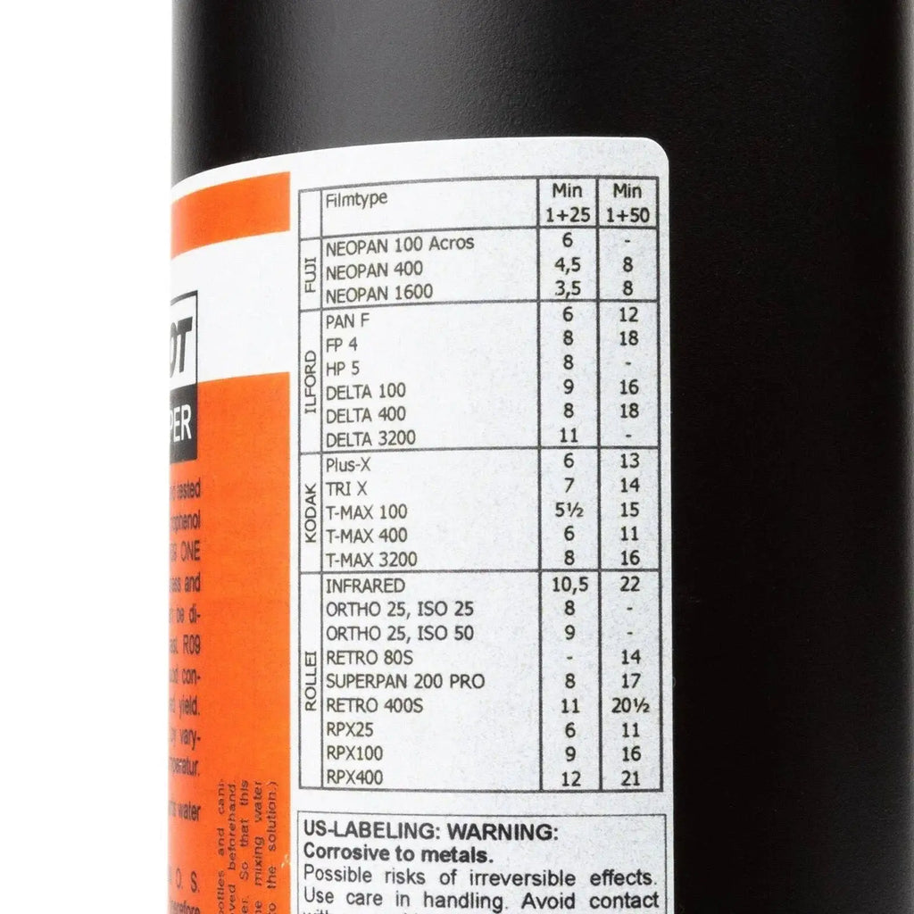 Black cylindrical container with orange and white label showing film type info for rollei compard r09 agfa rodinal formula developer