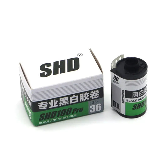 SHD 100 Pro DX black and white 35mm film with box, ideal for photography, ISO 100, expires 08/2026.