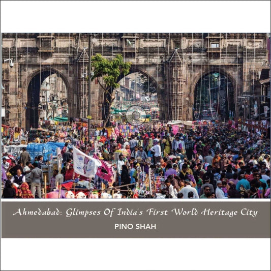 Crowded market scene in Ahmedabad, showcasing India's first World Heritage City by Pino Shah.
