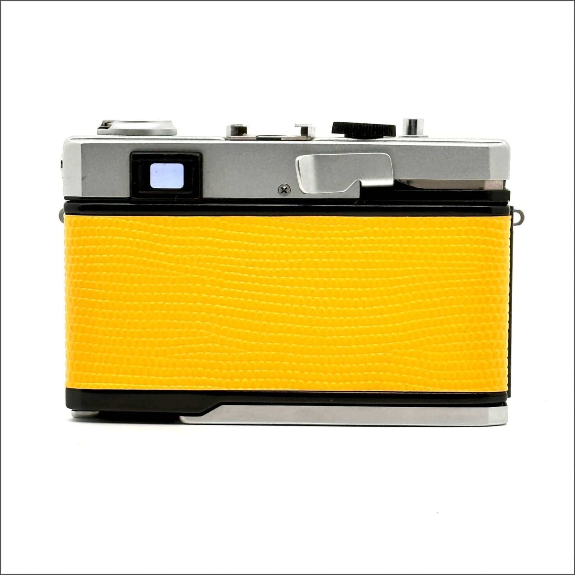 Olympus 35 Rc used 35mm yellow rangefinder film camera with a sleek silver body.