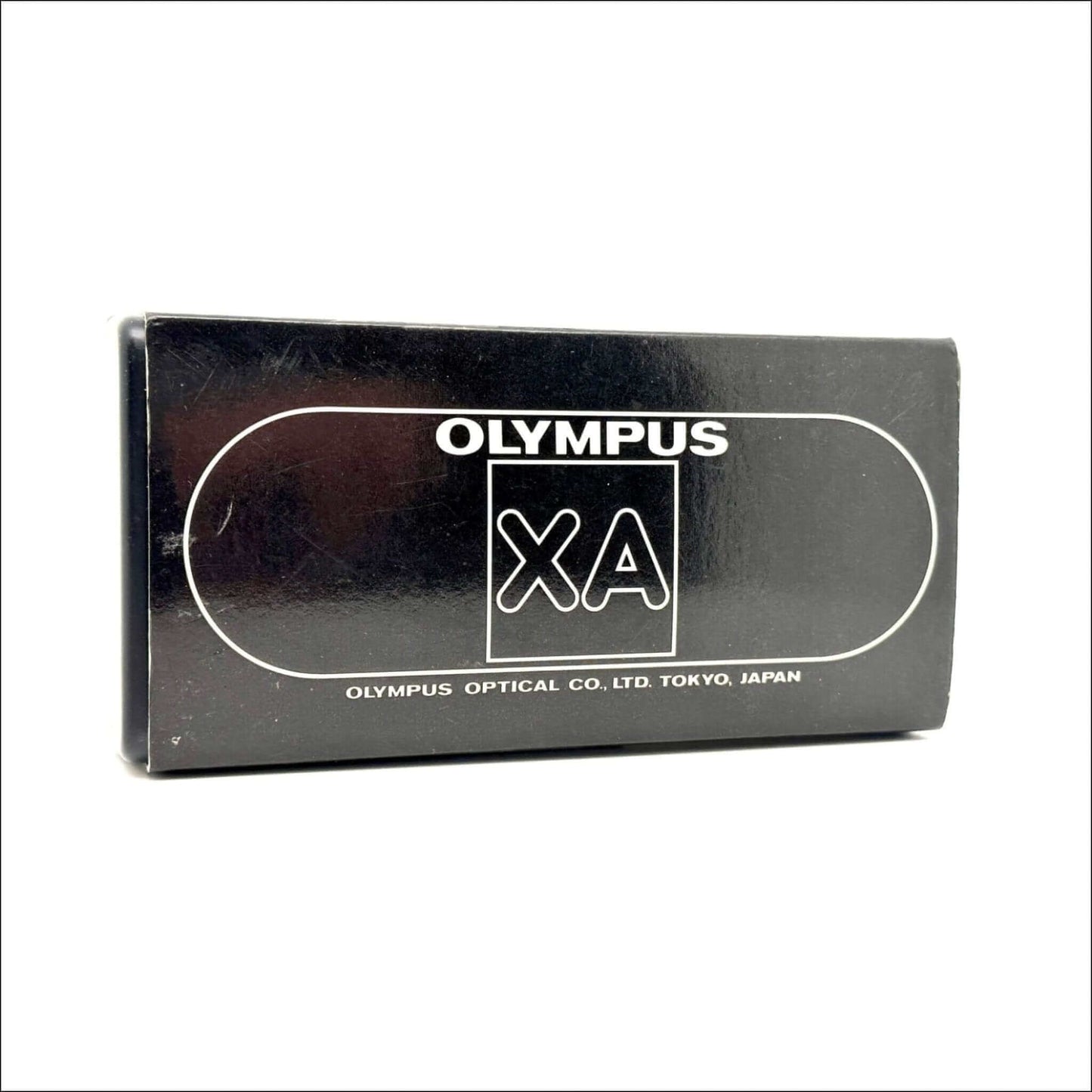 Olympus XA vintage camera box, showing brand logo and made in Japan details, in excellent condition.