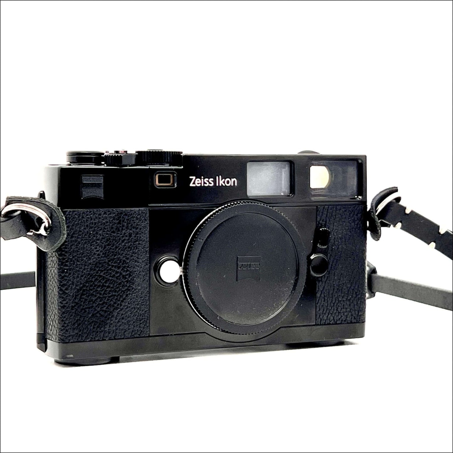 Zeiss Ikon ZM vintage 35mm film camera body in black with strap, compatible with Leica M mount lenses.