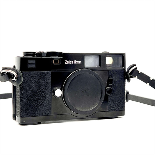 Zeiss Ikon ZM vintage 35mm film camera body in black with strap, compatible with Leica M mount lenses.